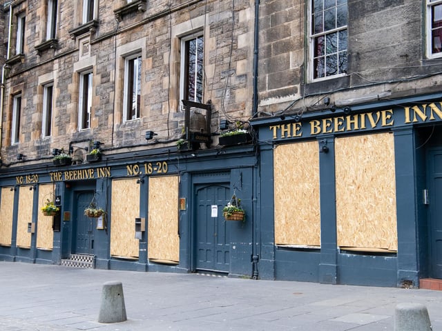 Deserted streets in Grassmarket, Edinburgh, where The Beehive Inn has been pictured with boarded up windows