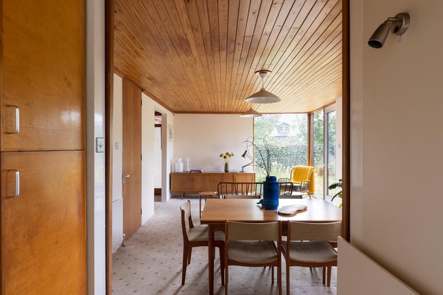 Softwood timber ceilings extend overhead and white walls surround the open space. The current owner has a sitting area arranged in the corner and a dining table positioned centrally, but the versatile space would suit a variety of layouts.