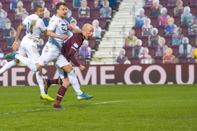 Liam Boyce pulls a goal back fro Hearts to make it 3-1.