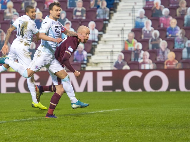 Liam Boyce pulls a goal back fro Hearts to make it 3-1.