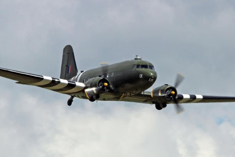 The Battle of Britain Memorial Flight Dakota wings its way over Pleasley.