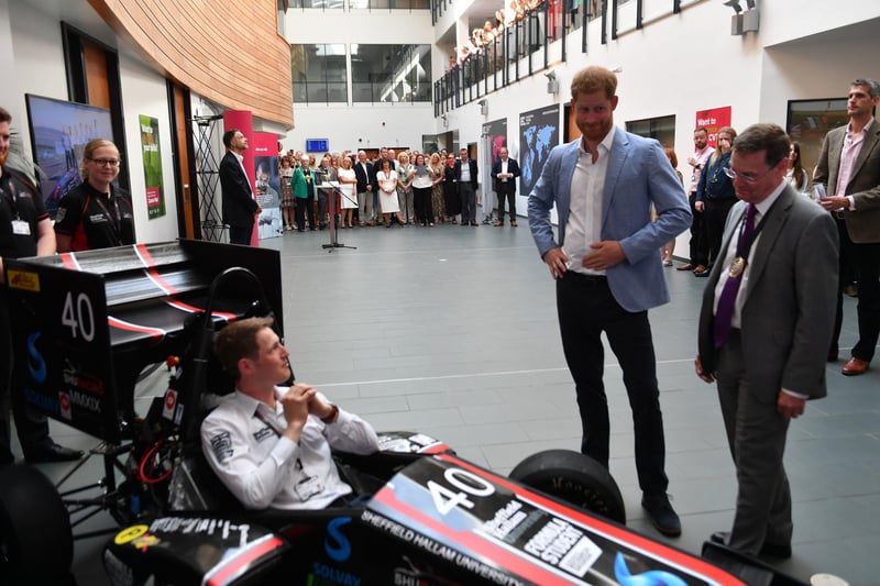 Prince Harry speaks to students and staff involved in the SHU Racing Team project during a visit to Sheffield Hallam University, to learn about their commitment to applied learning in teaching and research, on July 25, 2019