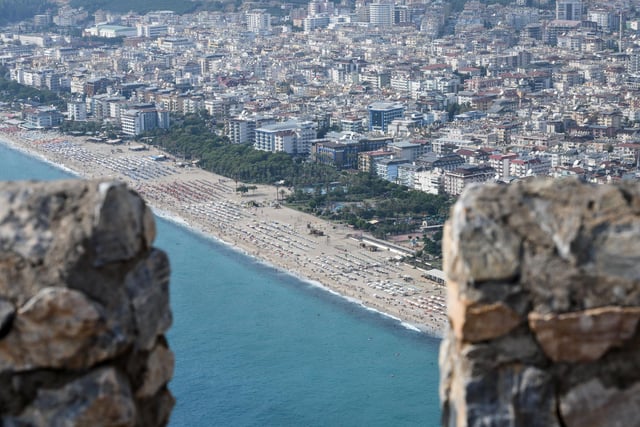 You can fly here from June 13. Pictured: People enjoy beach on August 18, 2019 in Alanya, Turkey.