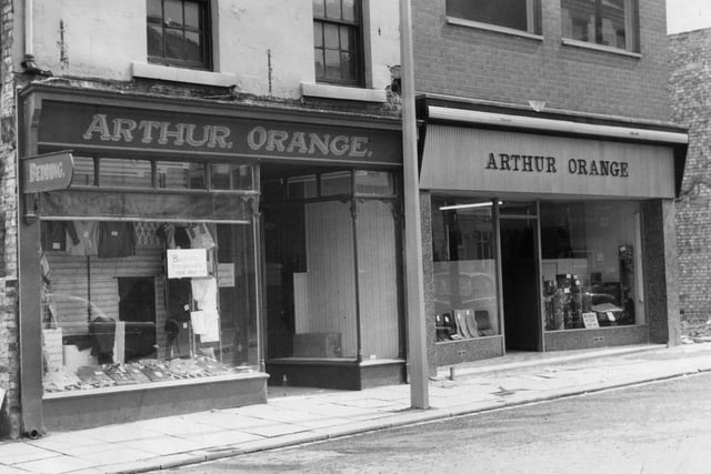 The old and the new stand together at the Arthur Orange shop in 1962.
