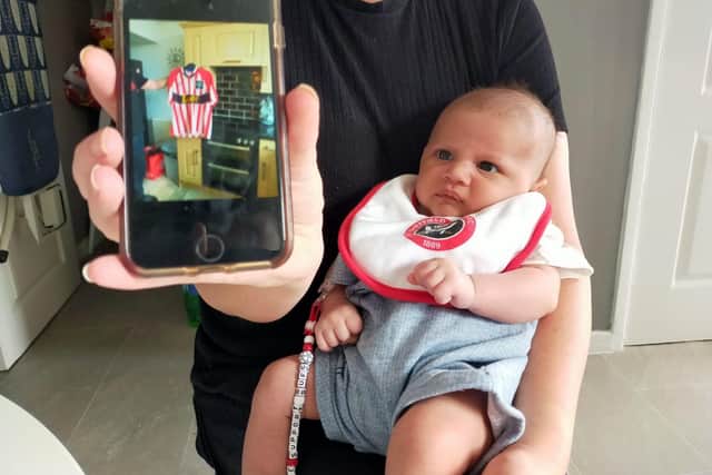 Lyndsey Grayson, pictured in May 2022 with her son Ronnie, who is already representing with Blades colours.
