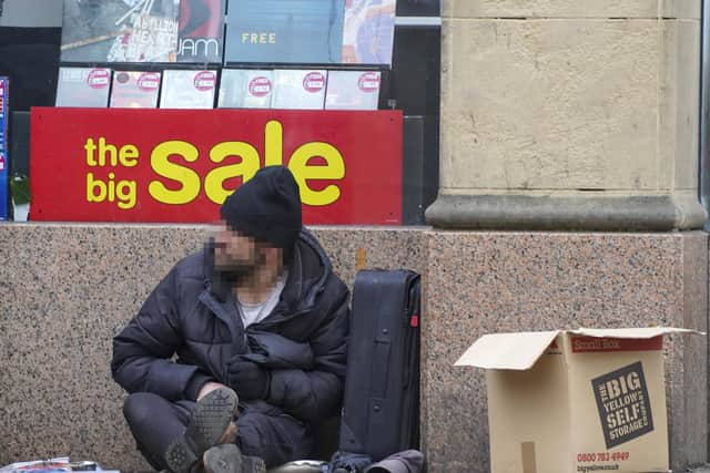 Beggar on High St in Sheffield city centre. Picture Scott Merrylees