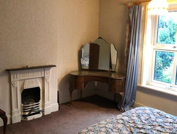 The bedrooms have ornate cast iron open fireplaces