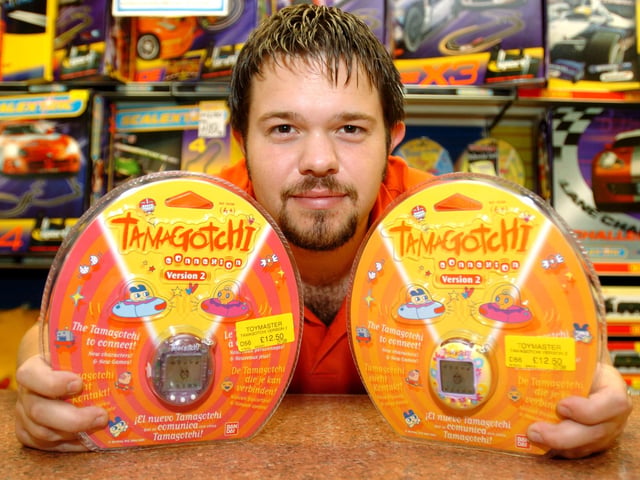 Tom Evans Assistant Manager of Toymaster in Meadowhall, with a Tamagotchi which was predicted to be a Christmas best seller