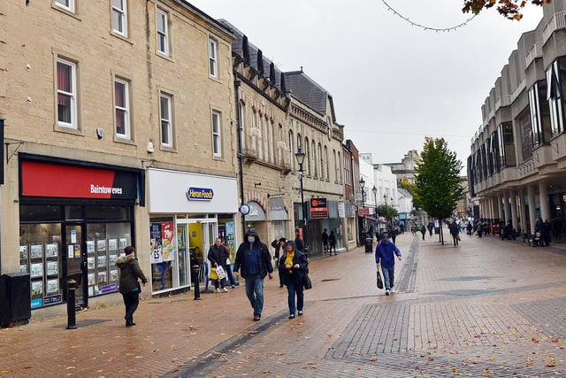 Mansfield town centre in new tier two lockdown. Masked shoppers took to the streets as normal.