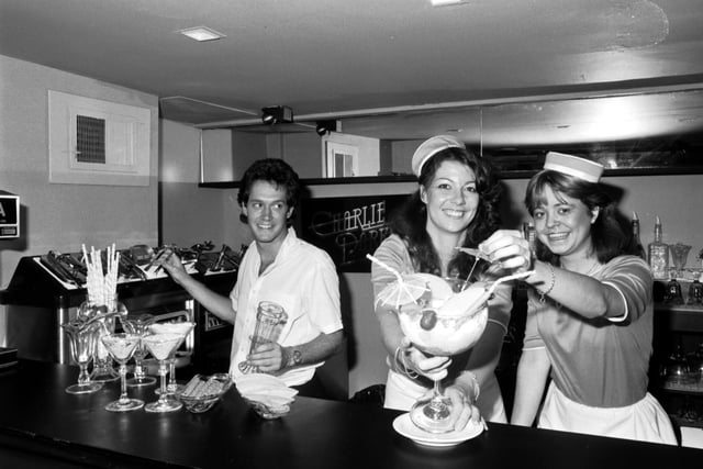 Waitress staff preparing a special sundae at Charlie Parkers Restaurant and Cocktail Bar, George Street, Edinburgh.  September 1981