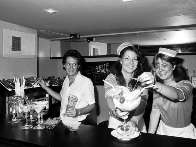 Waitress staff preparing a special sundae at Charlie Parkers Restaurant and Cocktail Bar, George Street, Edinburgh. September 1981
