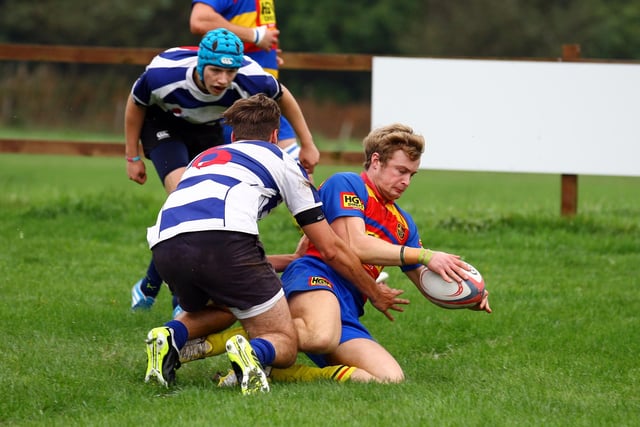 Buxton's Jamie Lowery scores a try.
