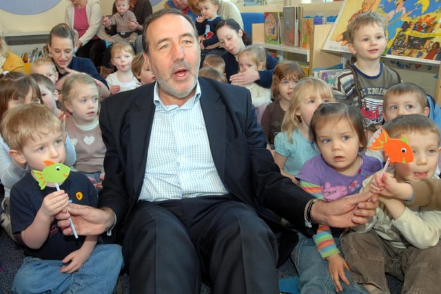 MP Paddy Tipping is pictured with youngsters from the Applegarth Day Nursery at a Rattle, Rhyme and Roll session at Hucknall Library.