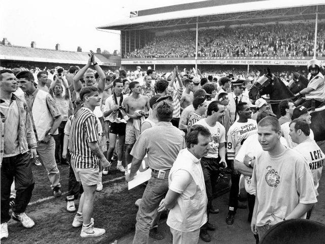 The promotion party gets under way on the pitch at Leicester