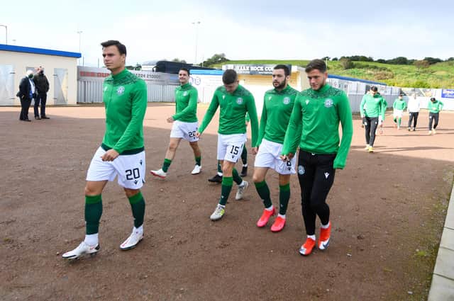 The Hibs squad take the field at the Balmoral for the pre-match warm-up