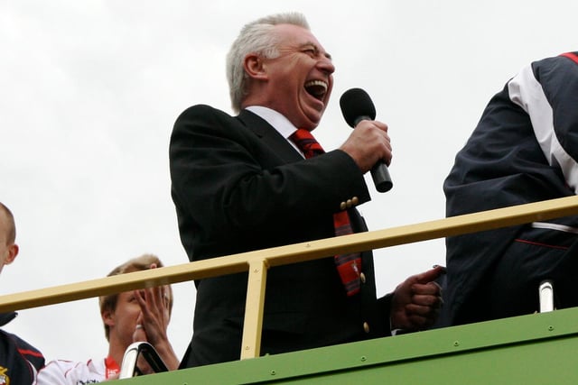 John Ryan shares a joke with Rovers fans from atop the open top bus