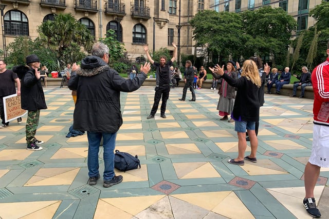 Some protestors join a meditation circle ahead of the protest