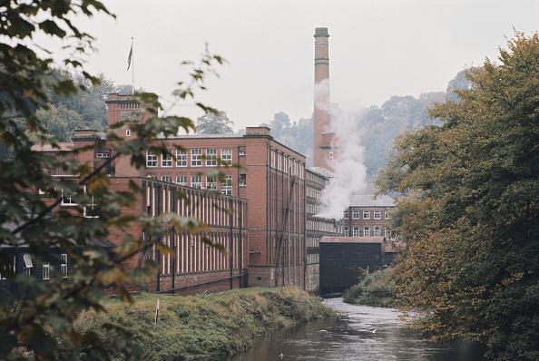 In 1721, Derby Silk Mill became the world's first factory, built for the Lombe brothers beside the River Derwent containing spinning machines. These required familiar large buildings seen today be built with a power source.