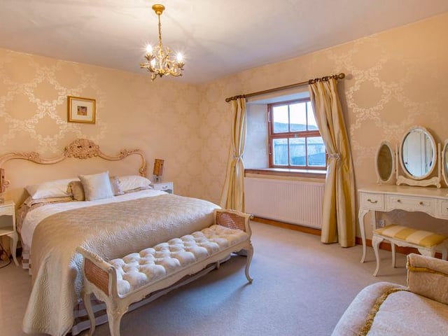 There are five good-sized bedrooms with feature fireplaces.