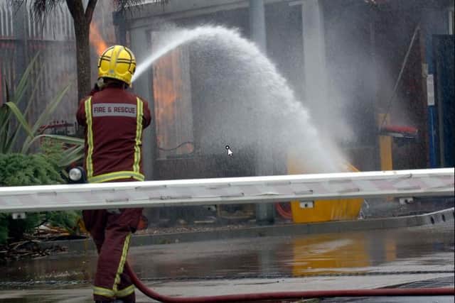 File picture shows South Yorkshire fire fighters. A car was set alight in an arson attack attended by fire crews last night