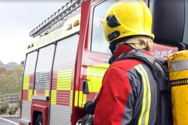 Firefighters tackling blazes started by arsonists in Barnsley have had rocks thrown at them. Stock picture of a firefighter