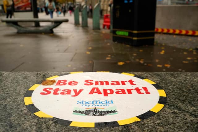 A Covid-19 awareness sign greets shoppers in the city centre (Photo by Christopher Furlong/Getty Images)