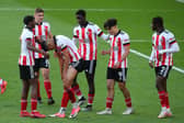 Will Osula of Sheffield United is congratulated by his teammates after sealing his hat-trick against Ipswich: Simon Bellis / Sportimage
