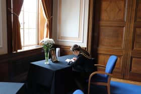 Mayor of Barnsley Councillor Sarah Tattersall signs the book of condolences in the Town Hall
