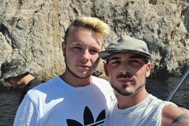Andrew James and his partner. Andrew was allegedly assaulted over the weekend by a man who punched him and said: "You deserve it, you're gay."