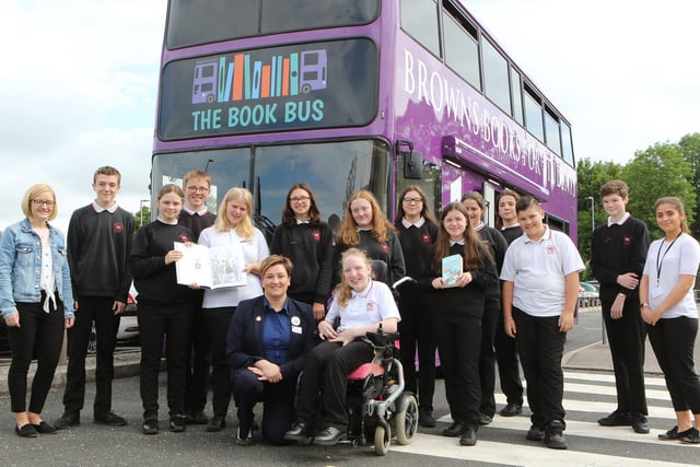Chapel High School's student librarians are joined by Ali Co of Tesco as they visit the book bus to spend the money raised by the store's Bags of Help scheme 