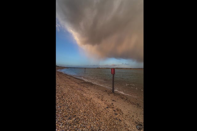 Menacing Cloud and a Rainbow in the distance at Eastney Beach