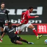 Zak Vyner of Bristol City in action with Lewis Wing and Wes Harding of Rotherham United.