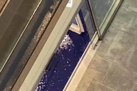 Several stores in the new development were impacted by the heavy rainfall. This is a screenshot of a video showing water flooding the entrance to Boots in St James Quarter.