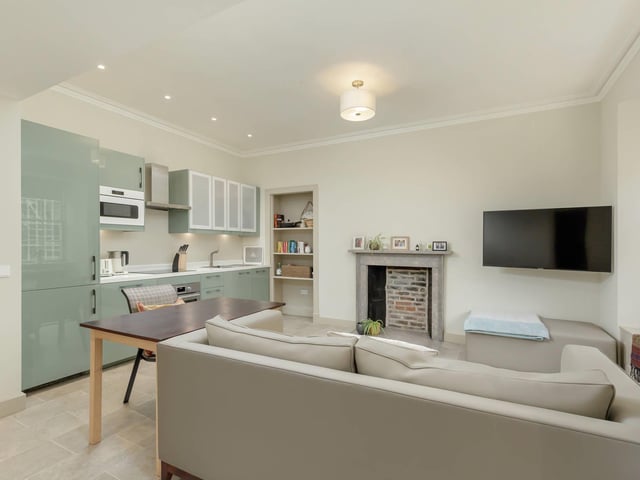 The lower ground floor has been designed to function as its own self-contained flat, with an entrance from the street. The accommodation benefits from a large open-plan kitchen and living room, a double bedroom, shower room and utility room.