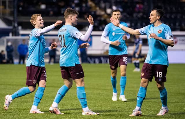 Ewan Henderson celebrates after doubling the scoring for Hearts. Picture: SNS
