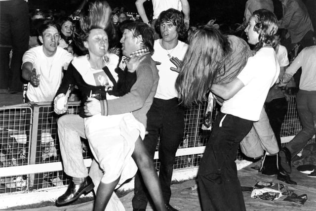 Thousands of screaming teenage girls at a David Cassidy concert at Shawfield stadium in May 1974 - security staff had to lift them over the barriers and some girls were hurt during the show.