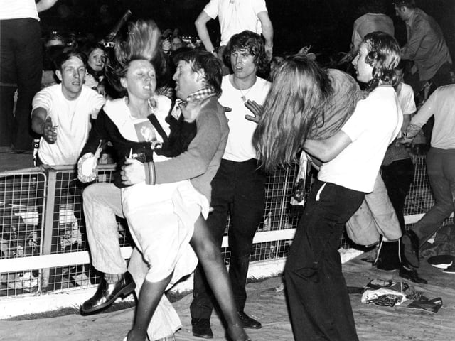 Thousands of screaming teenage girls at a David Cassidy concert at Shawfield stadium in May 1974 - security staff had to lift them over the barriers and some girls were hurt during the show.