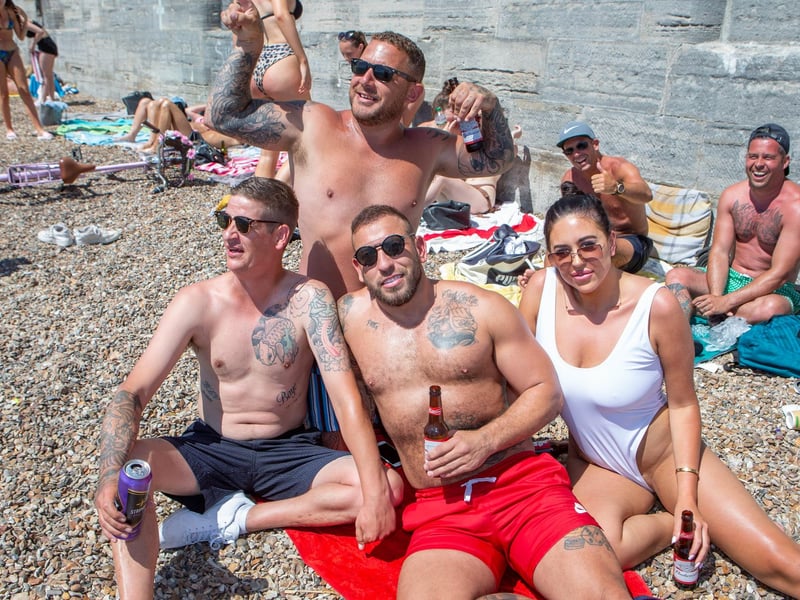 Friends having fun at Hotwalls in Old Portsmouth and making the most of the sunshine. Picture: Habibur Rahman