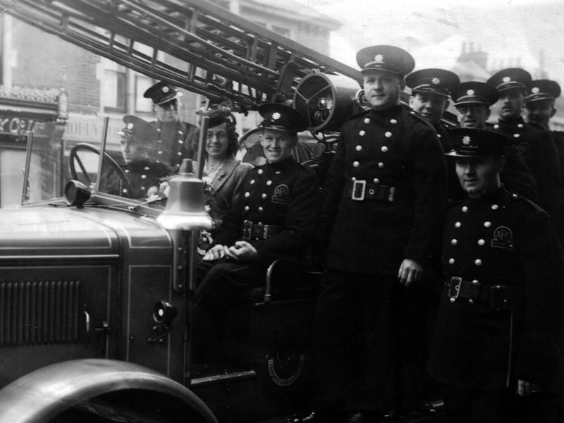 Fireman's wedding. Sent in by Ken Blake here wee see a wedding scene taken on March 4th 1942 and he would like to know who the bride and groom are.
Ernest Blake, Ken's father is third from the right back row and behind him is a man known as 'Lofty' Heridge.
During their off duty periods these men would make wooden toys for the underprivileged children of Portsmouth. If you know who they are please let us know