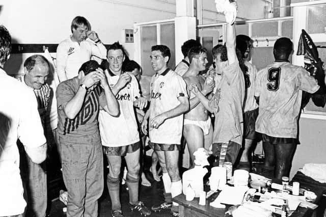 Celebrations in the changing room at Leicester