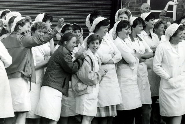 Staff at Fletchers wave goodbye as Princess Anne leaves after a visit to the bakery in May 1986