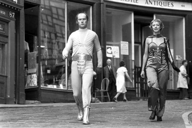 Patrick Malahide and unidentified female take to the Edinburgh streets dressed as robots to promote The Android People at the Traverse theatre during Edinburgh festival Fringe 1978.