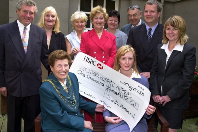 The Mayor of Doncaster, Councillor Maureen Edgar,  and Wendy Bennett, were pictured with the £1,000 for St John's Hospice in 2000. Looking on at the presentation held at the Mansion House are, from left, Graham Rockliff, Margaret Rockliff, Sheila Fieldhouse, Fay Selby, Julie Murray, Bruce Selby, Cancer Detection Trust treasurer Peter Mellor, and Linda Morton.