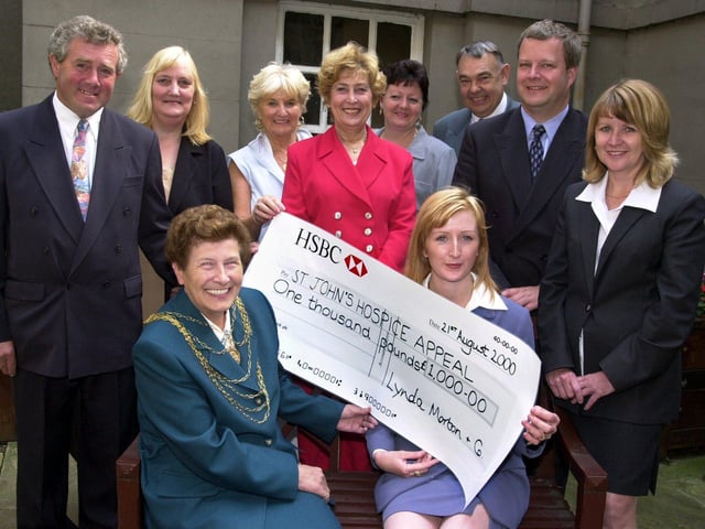 The Mayor of Doncaster, Councillor Maureen Edgar,  and Wendy Bennett, were pictured with the £1,000 for St John's Hospice in 2000. Looking on at the presentation held at the Mansion House are, from left, Graham Rockliff, Margaret Rockliff, Sheila Fieldhouse, Fay Selby, Julie Murray, Bruce Selby, Cancer Detection Trust treasurer Peter Mellor, and Linda Morton.