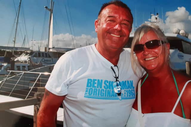 June Lowe is urging people to get any heart disease symptoms checked out so others do not have to go through what she did in November 2016, when her husband, Dave, suffered a heart attack diving at the Great Barrier Reef. This was the last picture taken of them together before they boarded a boat for the dive.