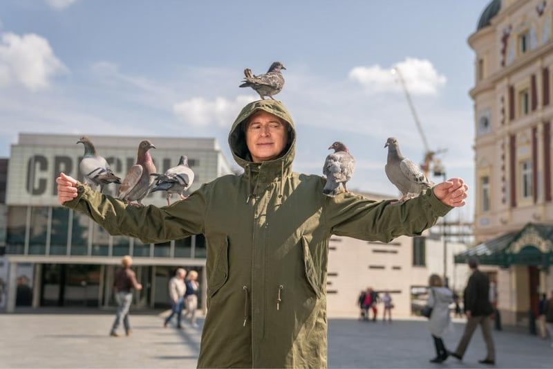 Robert Carlisle, coveried in pigeons, outside the Crucible Theatre on Tudor Square  in the new Full Monty series. Picture: Disney+