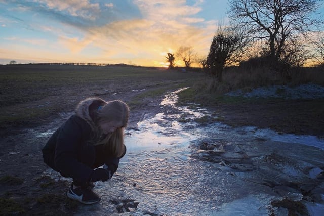 Sarah Breckon sent in this photo of her daughter examining some ice.