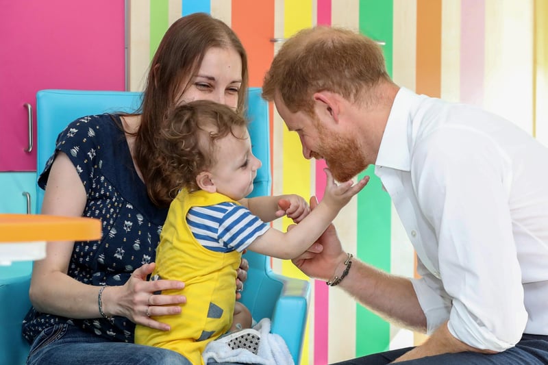 Prince Harry, Duke of Sussex plays with one-year-old Noah Nicholson during a visit to Sheffield Children's Hospital on July 25, 2019