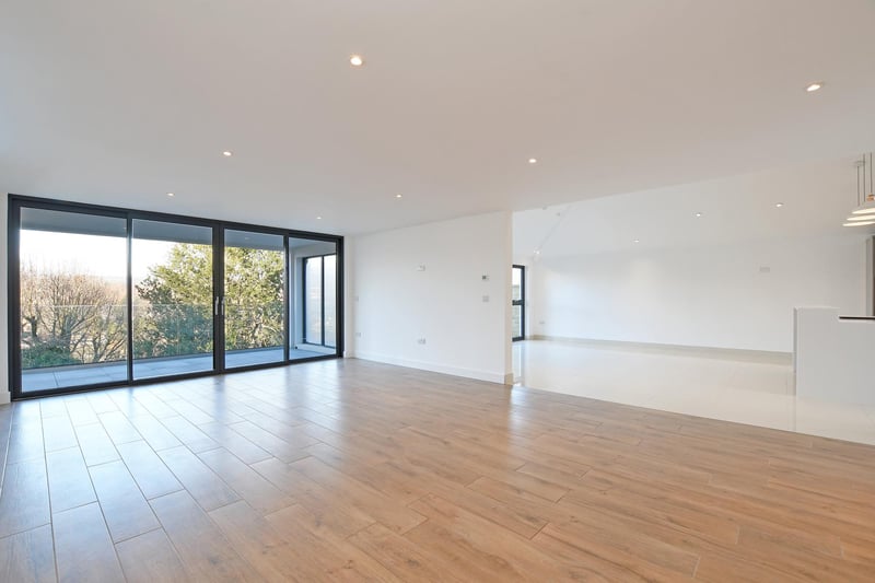 A good-sized reception room, it opens out onto a covered balcony for enjoying the views. There is also tiled flooring with under floor heating.