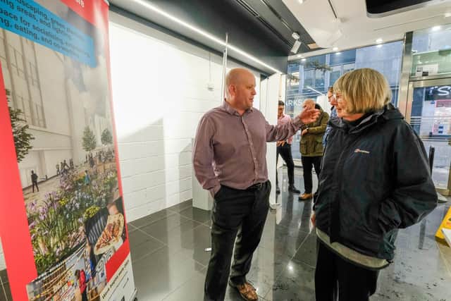 Project manager Lee Long, of civil engineers Sisk, outlines Fargate revamp plans to a visitor at a pop-up event.